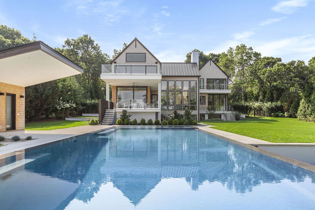 The Sag Harbor Home is a newly constructed and designed waterfront masterpiece designed by renowned architect Peter Cook now available for sale. This home located at 110 Hillside Dr E, Sag Harbor, New York; offering 8 bedrooms and 11 bathrooms with over 6,700 square feet of living spaces.