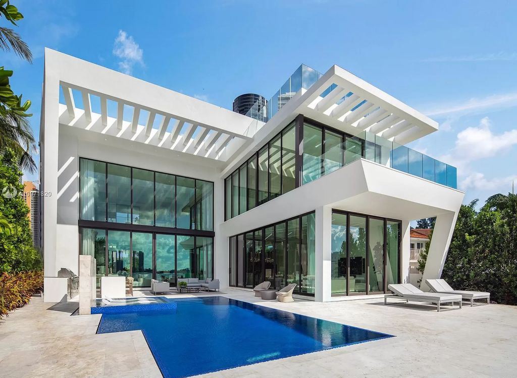 The Waterfront Home in Florida is a brand new contemporary residence featuring bespoke architectural details now available for sale. This home located at 18530 N Bay Rd, Sunny Isles Beach, Florida; offering 6 bedrooms and 9 bathrooms with over 3,500 square feet of living spaces.