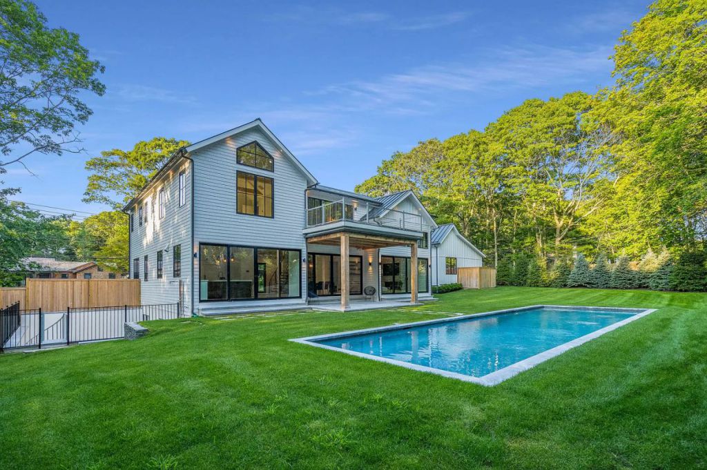 The East Hampton House is a newly constructed modern farmhouse on a prime half-acre parcel both aesthetically and functionally now available for sale. This home located at 51 Wireless Rd, East Hampton, New York; offering 6 bedrooms and 7 bathrooms with over 5,600 square feet of living spaces.