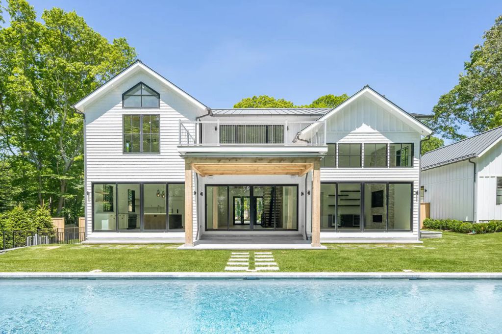 The East Hampton House is a newly constructed modern farmhouse on a prime half-acre parcel both aesthetically and functionally now available for sale. This home located at 51 Wireless Rd, East Hampton, New York; offering 6 bedrooms and 7 bathrooms with over 5,600 square feet of living spaces.