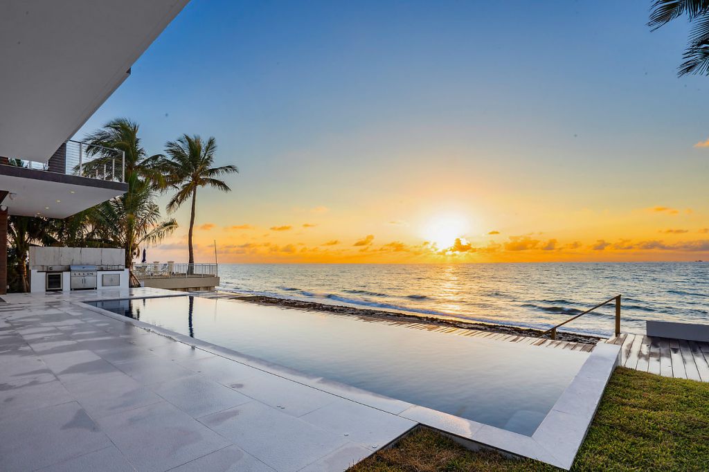 This Oceanfront Home in South Palm Beach, Florida was designed by Choeff Levy Fischman in tropical modern style with 5 bedrooms and 5 bathrooms; this house offers luxurious living with high end finishes and smart amenities. This home located on beautiful lot with amazing sea views and wonderful outdoor living spaces including patio, pool, garden.