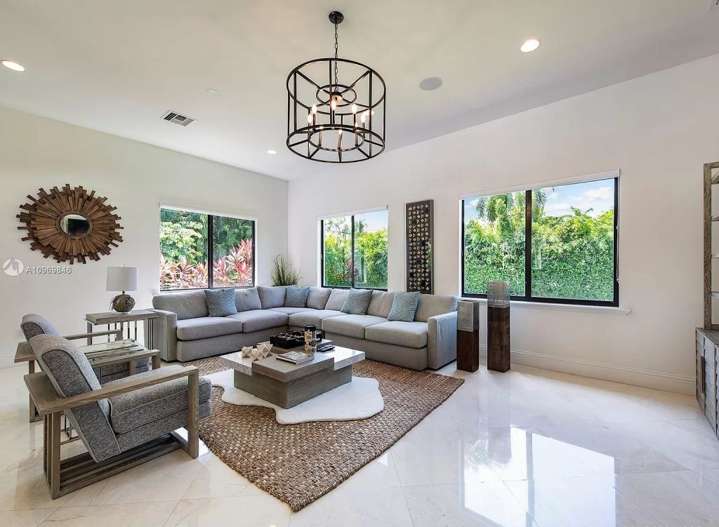 The Pinecrest Home is a classic and superior architectural design property with exquisite, finest modern finishes and details now available for sale. This home located at 13000 SW 63rd Ave, Pinecrest, Florida; offering 6 bedrooms and 8 bathrooms with over 8,800 square feet of living spaces.