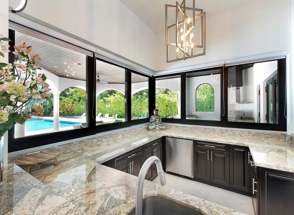 The Pinecrest Home is a classic and superior architectural design property with exquisite, finest modern finishes and details now available for sale. This home located at 13000 SW 63rd Ave, Pinecrest, Florida; offering 6 bedrooms and 8 bathrooms with over 8,800 square feet of living spaces.