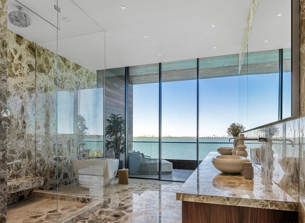 The Florida Mansion is a magnificent Venetian Islands estate with rich materials and bespoke details showcasing waterfront luxury living now available for sale. This home located at 835 E Di Lido Dr, Miami Beach, Florida; offering 7 bedrooms and 8 bathrooms with over 7,000 square feet of living spaces.