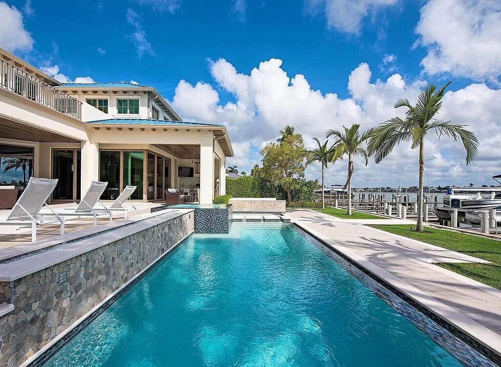 The Home in Naples is a luxurious coastal contemporary style residence features unparalleled quality meets unrivaled views now available for sale. This home located at 1959 8th St S, Naples, Florida; offering 4 bedrooms and 5 bathrooms with over 4,500 square feet of living spaces.