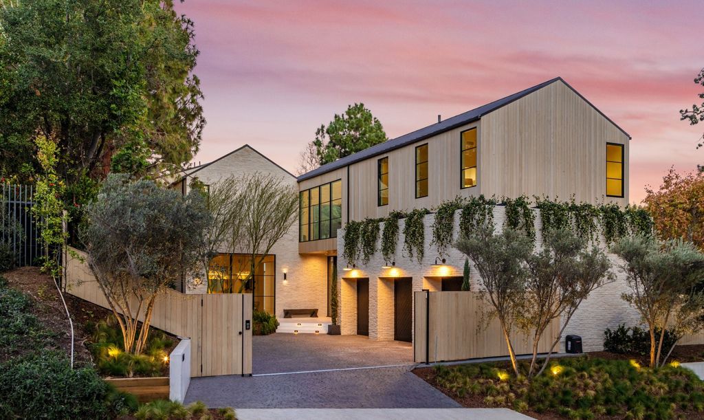 The Contemporary Farmhouse is a luxurious home invites nature and incredible sunlight into every room now available for sale. This home located at 1054 Angelo Dr, Los Angeles, California; offering 6 bedrooms and 8 bathrooms with over 10,500 square feet of living spaces.