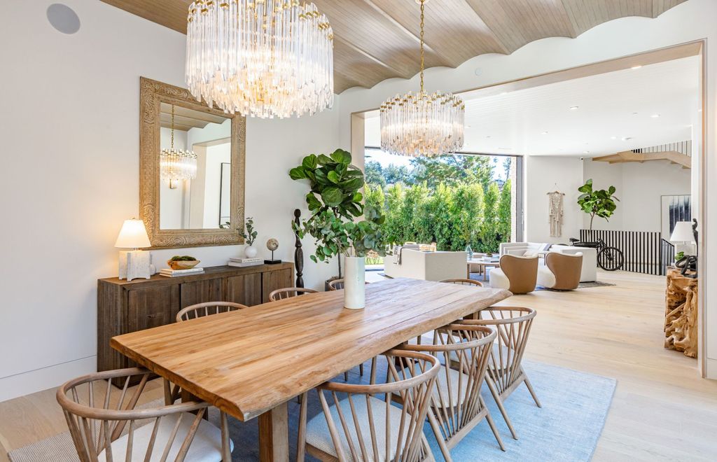 The Contemporary Farmhouse is a luxurious home invites nature and incredible sunlight into every room now available for sale. This home located at 1054 Angelo Dr, Los Angeles, California; offering 6 bedrooms and 8 bathrooms with over 10,500 square feet of living spaces.