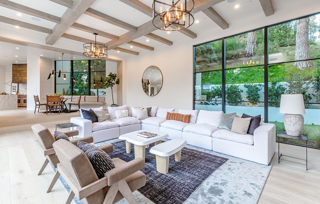 The Contemporary Farmhouse is a luxurious home invites nature and incredible sunlight into every room now available for sale. This home located at 1054 Angelo Dr, Los Angeles, California; offering 6 bedrooms and 8 bathrooms with over 10,500 square feet of living spaces.