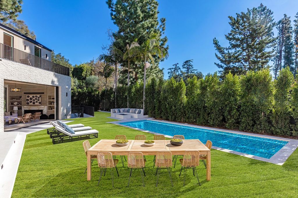 The Contemporary Farmhouse is a luxurious home invites nature and incredible sunlight into every room now available for sale. This home located at 1054 Angelo Dr, Los Angeles, California; offering 6 bedrooms and 8 bathrooms with over 10,500 square feet of living spaces.