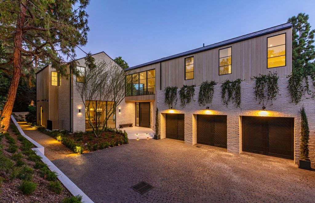 The Contemporary Farmhouse is a luxurious home invites nature and incredible sunlight into every room now available for sale. This home located at 1054 Angelo Dr, Los Angeles, California; offering 6 bedrooms and 8 bathrooms with over 10,500 square feet of living spaces.