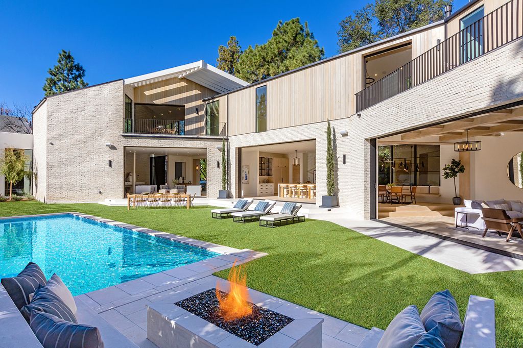 The Contemporary Farmhouse is a luxurious home invites nature and incredible sunlight into every room now available for sale. This home located at 1054 Angelo Dr, Los Angeles, California; offering 6 bedrooms and 8 bathrooms with over 10,500 square feet of living spaces.