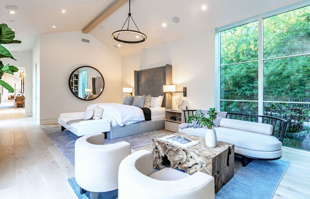 The Contemporary Farmhouse is a luxurious home invites nature and incredible sunlight into every room now available for sale. This home located at 1054 Angelo Dr, Los Angeles, California; offering 6 bedrooms and 8 bathrooms with over 10,500 square feet of living spaces.