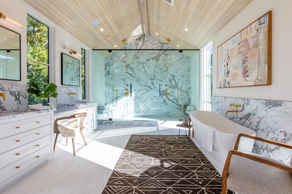 The Contemporary Farmhouse is a luxurious home invites nature and incredible sunlight into every room now available for sale. This home located at 1054 Angelo Dr, Los Angeles, California; offering 6 bedrooms and 8 bathrooms with over 10,500 square feet of living spaces.