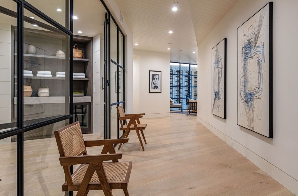 The Contemporary Farmhouse is a luxurious home invites nature and incredible sunlight into every room now available for sale. This home located at 1054 Angelo Dr, Los Angeles, California; offering 6 bedrooms and 8 bathrooms with over 10,500 square feet of living spaces.