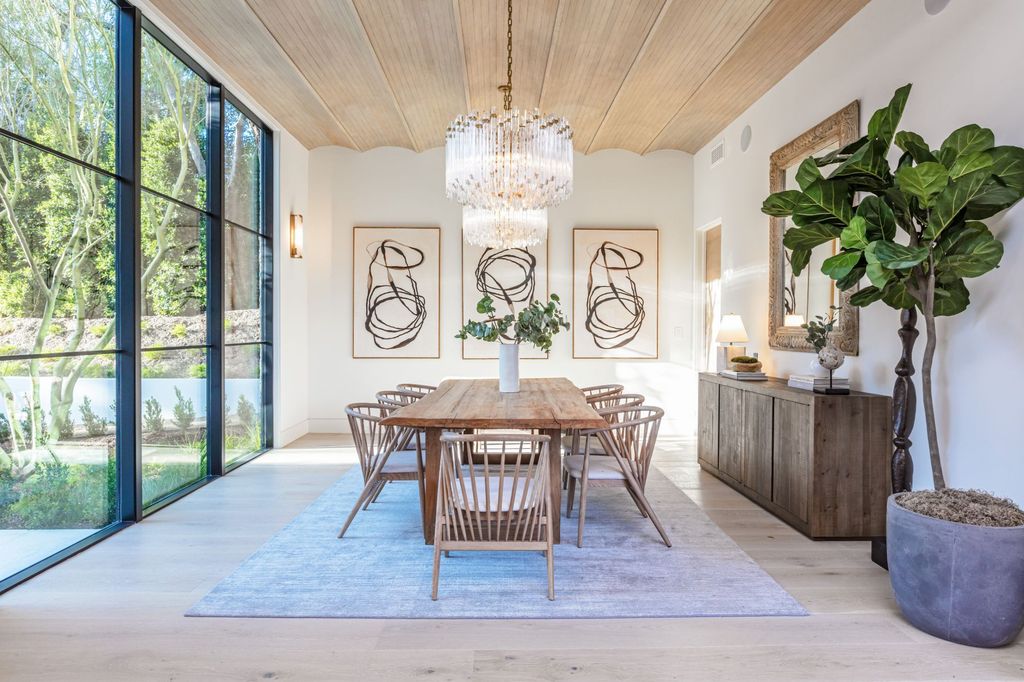 The Contemporary Farmhouse is a luxurious home invites nature and incredible sunlight into every room now available for sale. This home located at 1054 Angelo Dr, Los Angeles, California; offering 6 bedrooms and 8 bathrooms with over 10,500 square feet of living spaces.