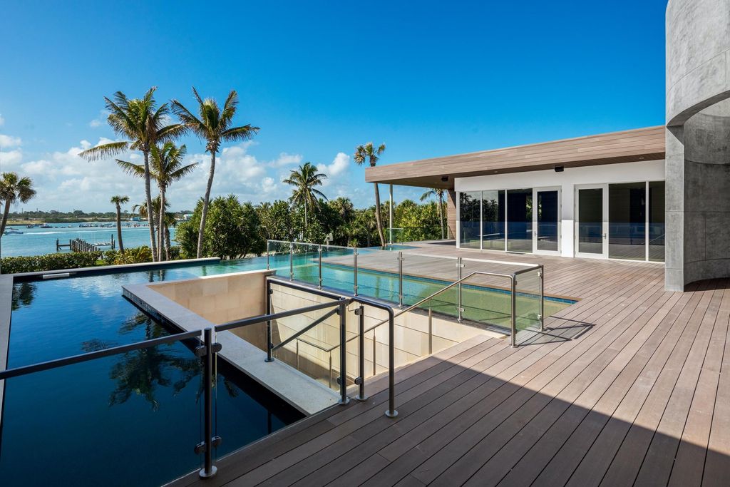 The Modern Mansion in Jupiter Island features spacious living and entertaining spaces with the most panoramic views of the Ocean now available for sale. This home located at 609 S Beach Rd, Jupiter, Florida; offering 6 bedrooms and 9 bathrooms with over 11,700 square feet of living spaces.