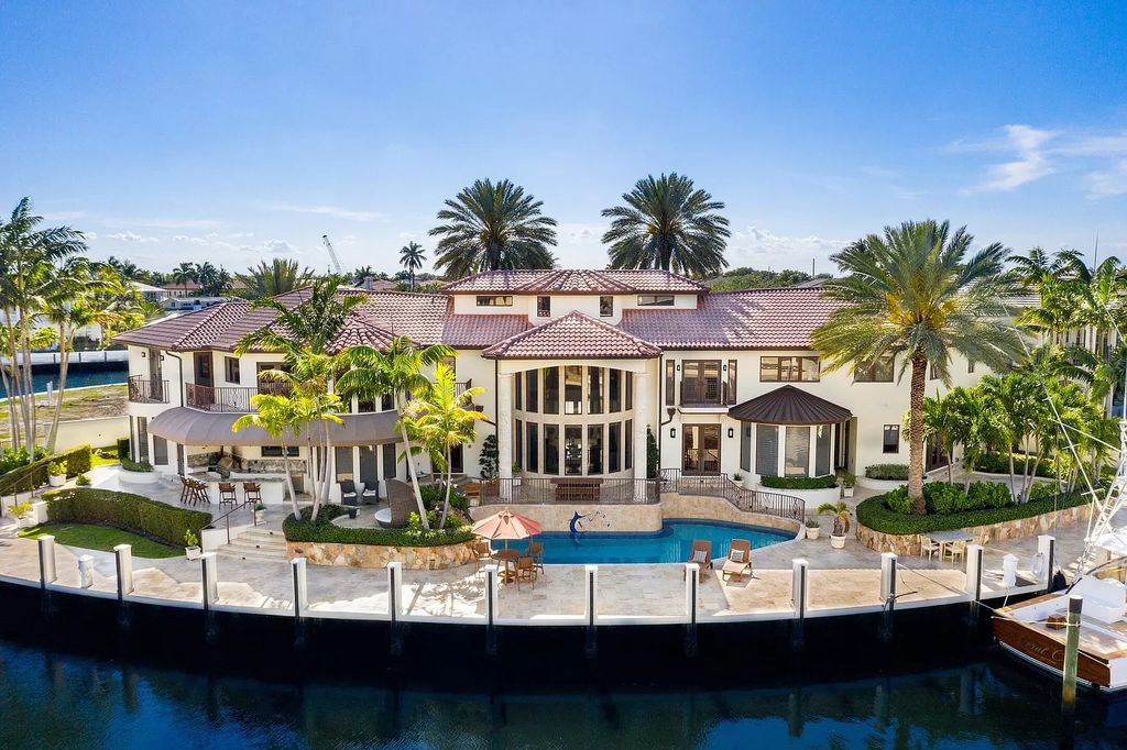 The Home in Lighthouse Point is an exceptional gated estate tucked away on a quiet cul-de-sac offering ultimate privacy now available for sale. This home located at 2541 NE 32nd Ct, Lighthouse Point, Florida; offering 6 bedrooms and 7 bathrooms with over 8,100 square feet of living spaces.