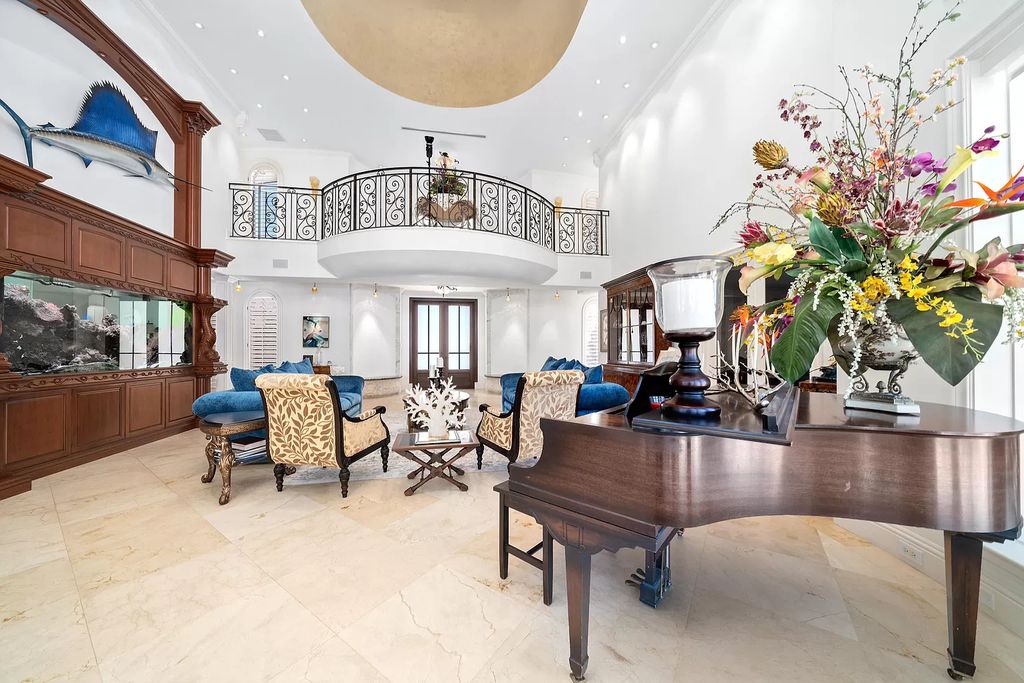 The Home in Lighthouse Point is an exceptional gated estate tucked away on a quiet cul-de-sac offering ultimate privacy now available for sale. This home located at 2541 NE 32nd Ct, Lighthouse Point, Florida; offering 6 bedrooms and 7 bathrooms with over 8,100 square feet of living spaces.