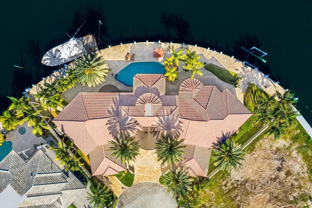 The Home in Lighthouse Point is an exceptional gated estate tucked away on a quiet cul-de-sac offering ultimate privacy now available for sale. This home located at 2541 NE 32nd Ct, Lighthouse Point, Florida; offering 6 bedrooms and 7 bathrooms with over 8,100 square feet of living spaces.
