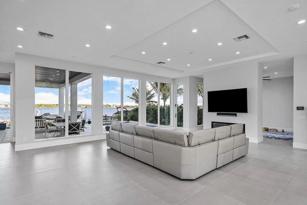 The Coastal Contemporary Home is an intracoastal estate boasting elegance, clean lines, walls of floor to ceiling glass with unobstructed views now available for sale. This home located at 2505 Lake Dr N, Boynton Beach, Florida; offering 4 bedrooms and 5 bathrooms with over 5,000 square feet of living spaces.