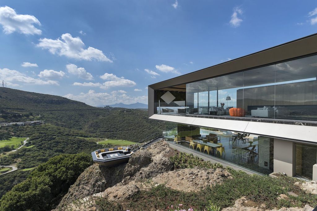 La Roca Home in Mexico was designed by RRZ Arquitectos in Modern style  offers a luxurious living of 1,500 square meter on a rocky hill with great views from every corner. This home located on wonderfully unique 7,500 square meter lot with amazing 360 degree views and incredible outdoor living spaces including patio, pool, garden.