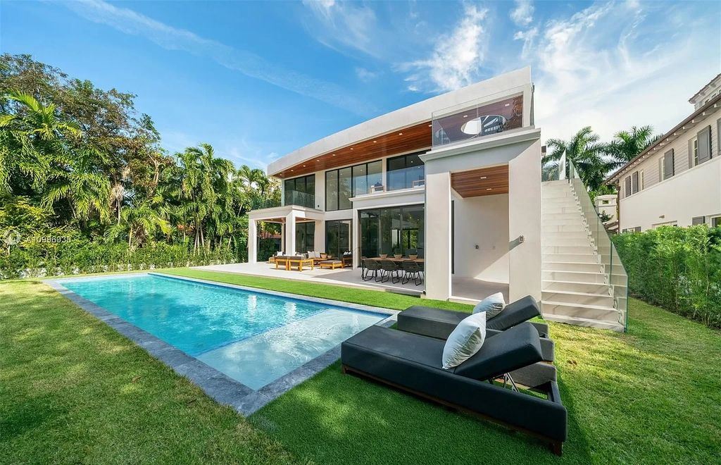 The Home in Miami Beach is a new construction modern oasis located on guard gated Hibiscus Island now available for sale. This home located at 112 W Palm Midway, Miami Beach, Florida; offering 5 bedrooms and 6 bathrooms with over 4,400 square feet of living spaces.