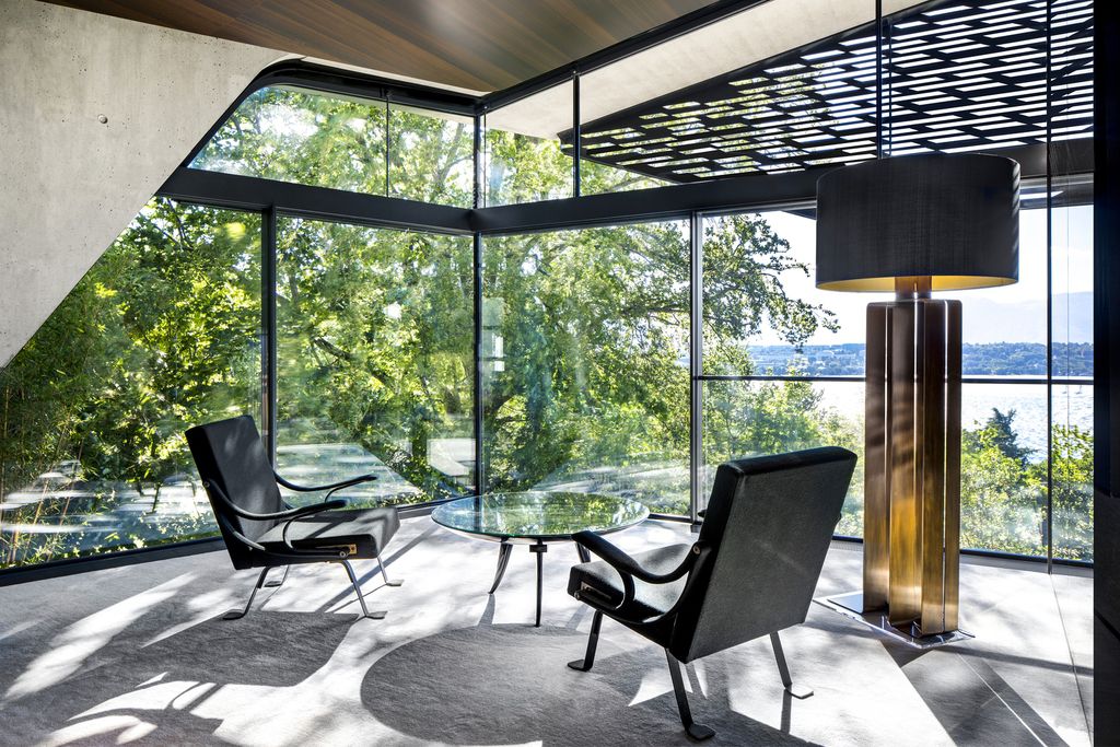 Modern Villa Courbe in Switzerland was designed by SAOTA in Modern style on spectacular lakeside setting perfect for private living and mix with the nature; this house offers luxurious living with high end finishes and smart amenities.