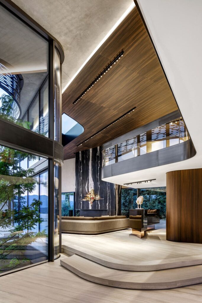 Modern Villa Courbe in Switzerland was designed by SAOTA in Modern style on spectacular lakeside setting perfect for private living and mix with the nature; this house offers luxurious living with high end finishes and smart amenities.