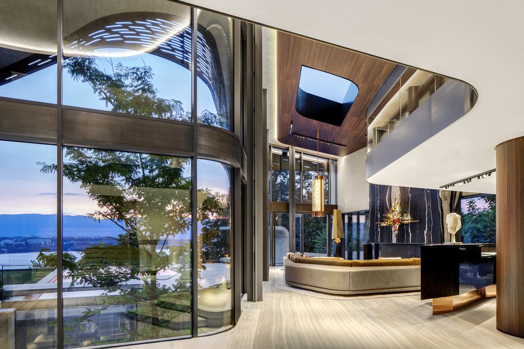 Modern Villa Courbe in Switzerland was designed by SAOTA in Modern style on spectacular lakeside setting perfect for private living and mix with the nature; this house offers luxurious living with high end finishes and smart amenities.