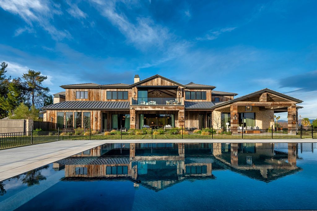 The California Property is an extraordinary newer rustic contemporary Farmhouse with explosive panoramic views now available for sale. This California Property located at 5521 Paradise Valley Rd, Hidden Hills, California; offering 6 bedrooms and 11 bathrooms with over 14,500 square feet of living spaces.