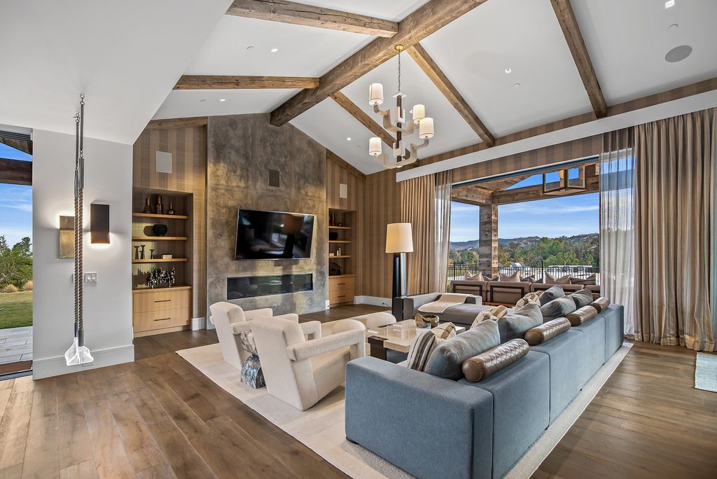 The California Property is an extraordinary newer rustic contemporary Farmhouse with explosive panoramic views now available for sale. This California Property located at 5521 Paradise Valley Rd, Hidden Hills, California; offering 6 bedrooms and 11 bathrooms with over 14,500 square feet of living spaces.