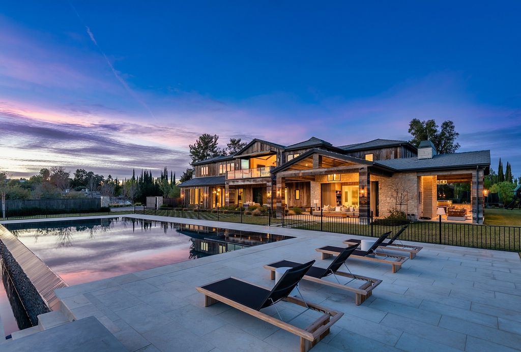 The California Property is an extraordinary newer rustic contemporary Farmhouse with explosive panoramic views now available for sale. This California Property located at 5521 Paradise Valley Rd, Hidden Hills, California; offering 6 bedrooms and 11 bathrooms with over 14,500 square feet of living spaces.