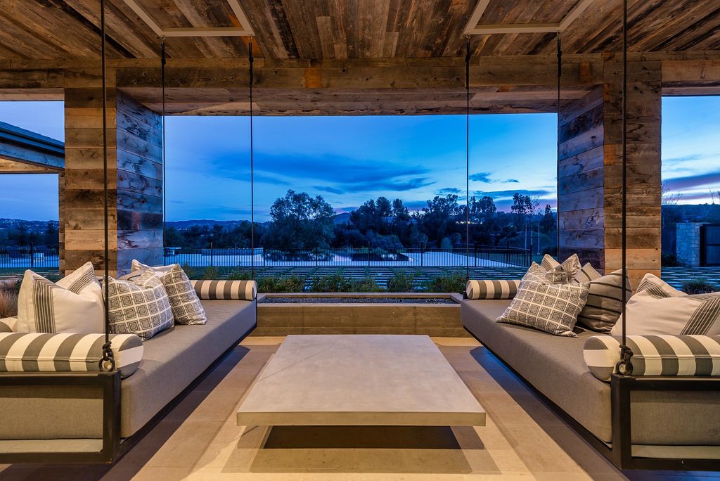 The California Property is an extraordinary newer rustic contemporary Farmhouse with explosive panoramic views now available for sale. This California Property located at 5521 Paradise Valley Rd, Hidden Hills, California; offering 6 bedrooms and 11 bathrooms with over 14,500 square feet of living spaces.