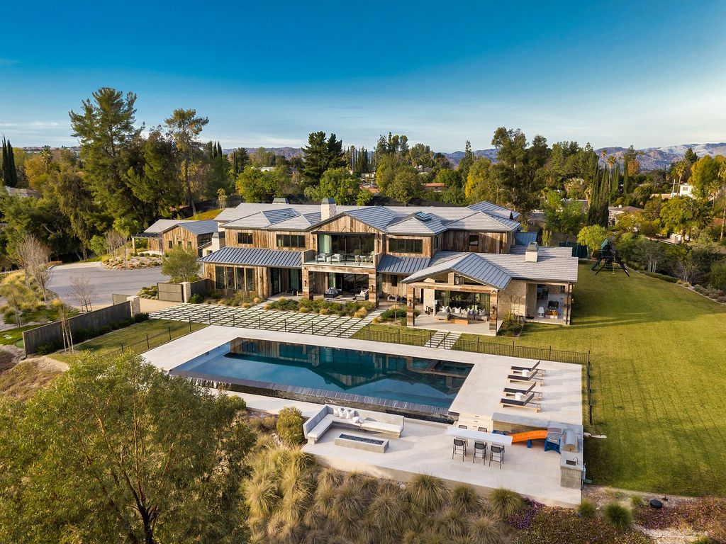 The California Property is an extraordinary newer rustic contemporary Farmhouse with explosive panoramic views now available for sale. This California Property located at 5521 Paradise Valley Rd, Hidden Hills, California; offering 6 bedrooms and 11 bathrooms with over 14,500 square feet of living spaces.