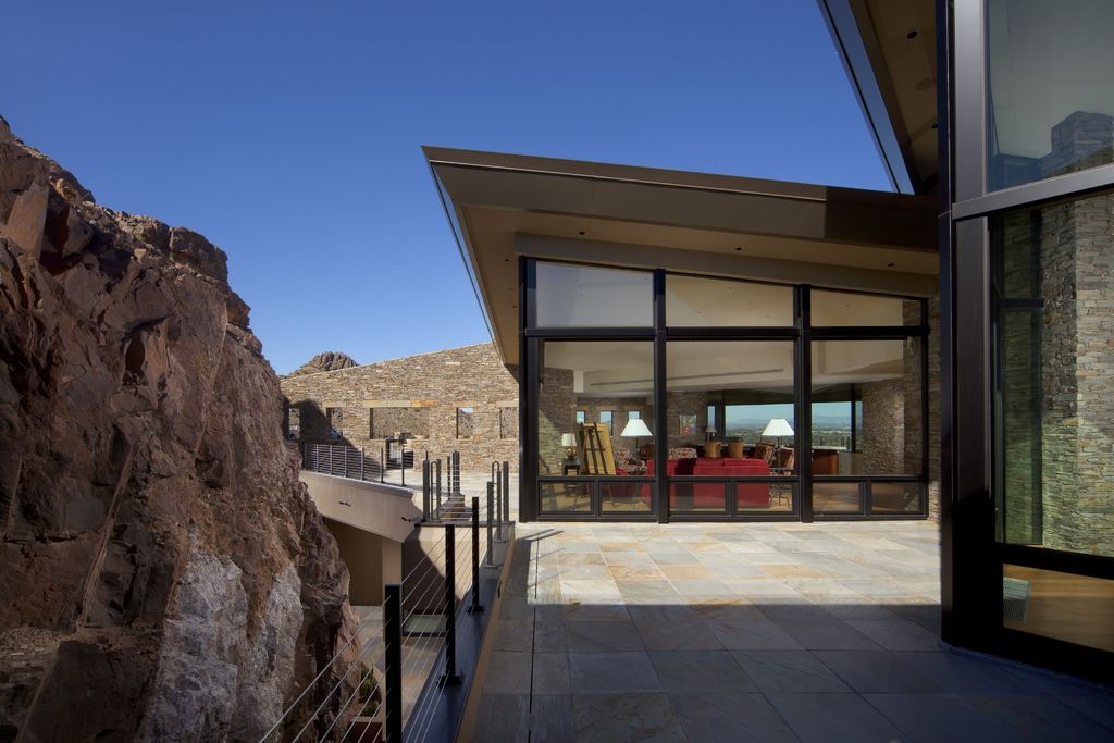 Desert Home in Desert Home, Arizona was designed by Candelaria Design in contemporary mountain style with 3 bedrooms and 4 bathrooms; this house offers luxurious living with high end finishes and smart amenities. 