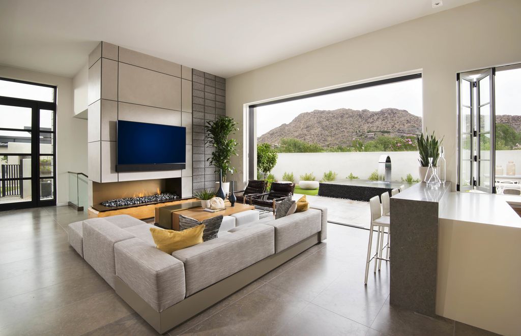 Desert Home in Desert Home, Arizona was designed by Candelaria Design in contemporary mountain style with 3 bedrooms and 4 bathrooms; this house offers luxurious living with high end finishes and smart amenities. 