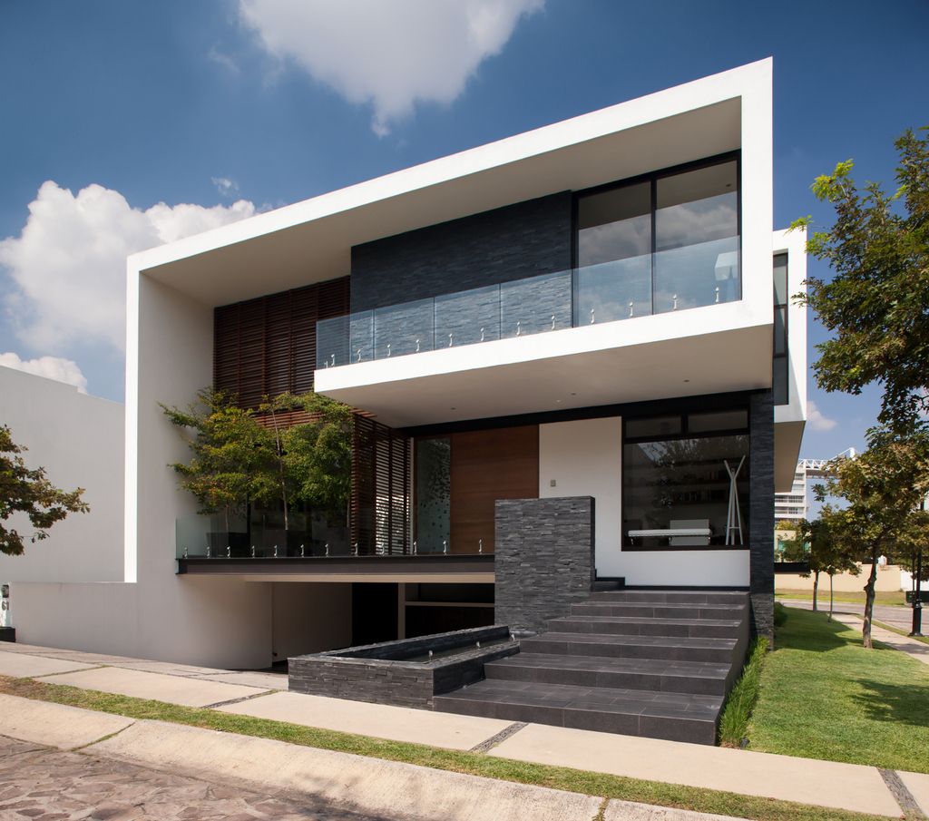 The GM House in Mexico was designed by GLR Architects in Modern style located on a corner in front of the access park of new urban area; this house offers luxurious living with high end finishes and smart amenities.