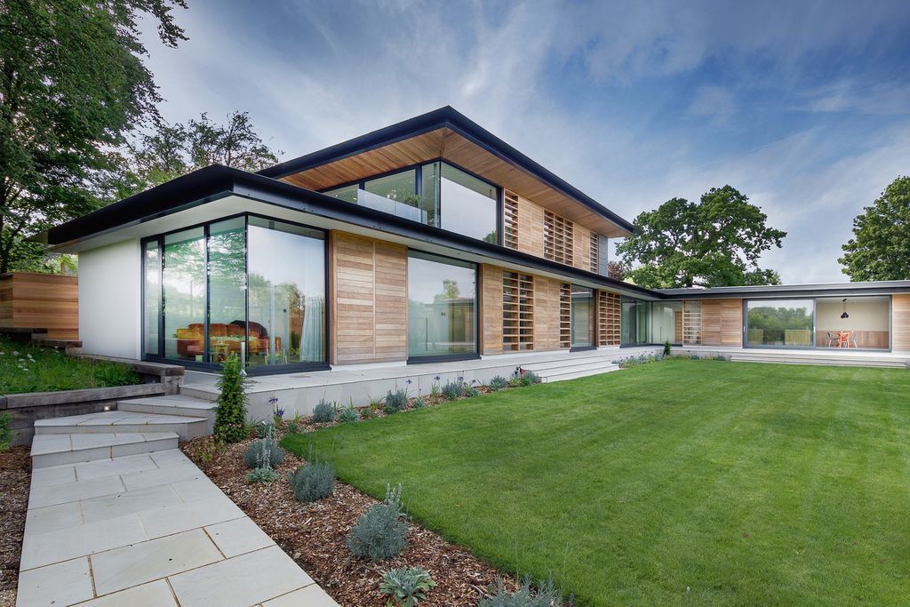Holm Place Residence in United Kingdom was designed by OB Architecture in contemporary style with concept is to create an exemplary modern home. The design aims to have a direct relationship to the garden, maximizing light and blurring the threshold between inside and outside.