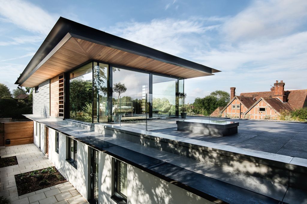 Holm Place Residence in United Kingdom was designed by OB Architecture in contemporary style with concept is to create an exemplary modern home. The design aims to have a direct relationship to the garden, maximizing light and blurring the threshold between inside and outside.