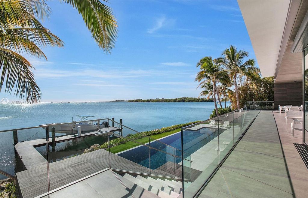 The Miami Waterfront Home is a sensational Biscayne Bay estate boasts open Bay Views now available for sale. This home located at 3591 Rockerman Rd, Miami, Florida; offering 5 bedrooms and 5 bathrooms with over 7,700 square feet of living spaces.