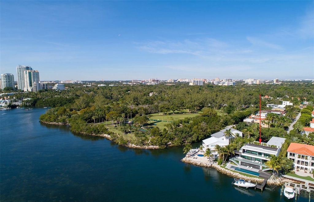 The Miami Waterfront Home is a sensational Biscayne Bay estate boasts open Bay Views now available for sale. This home located at 3591 Rockerman Rd, Miami, Florida; offering 5 bedrooms and 5 bathrooms with over 7,700 square feet of living spaces.