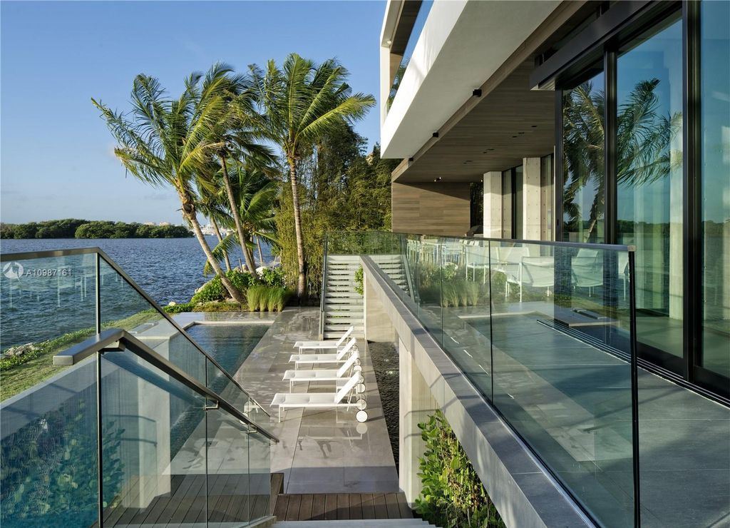 The Miami Waterfront Home is a sensational Biscayne Bay estate boasts open Bay Views now available for sale. This home located at 3591 Rockerman Rd, Miami, Florida; offering 5 bedrooms and 5 bathrooms with over 7,700 square feet of living spaces.