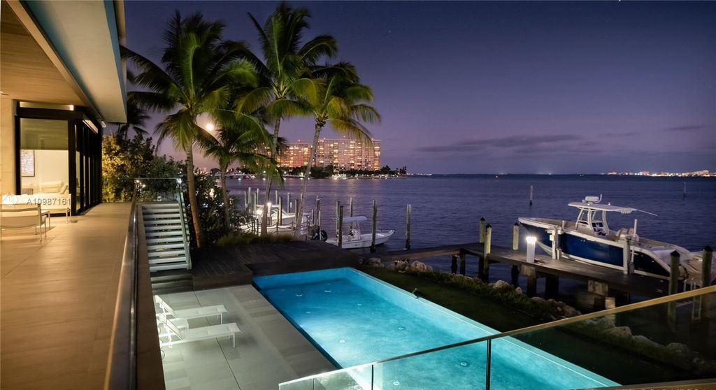 The Miami Waterfront Home is a sensational Biscayne Bay estate boasts open Bay Views now available for sale. This home located at 3591 Rockerman Rd, Miami, Florida; offering 5 bedrooms and 5 bathrooms with over 7,700 square feet of living spaces.