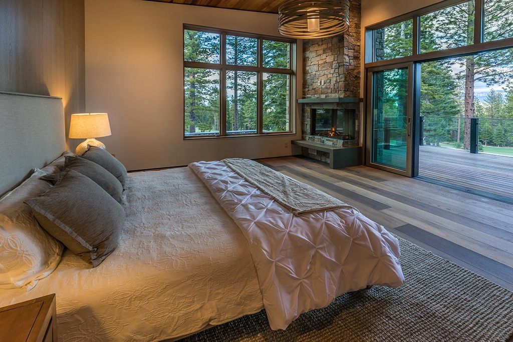 Martis Camp Home Lot 53 in Truckee, California was designed by Dennis Zirbel Architects in mountain contemporary style; this house offers impressive mountain views and expansive indoors and outdoors entertaining.