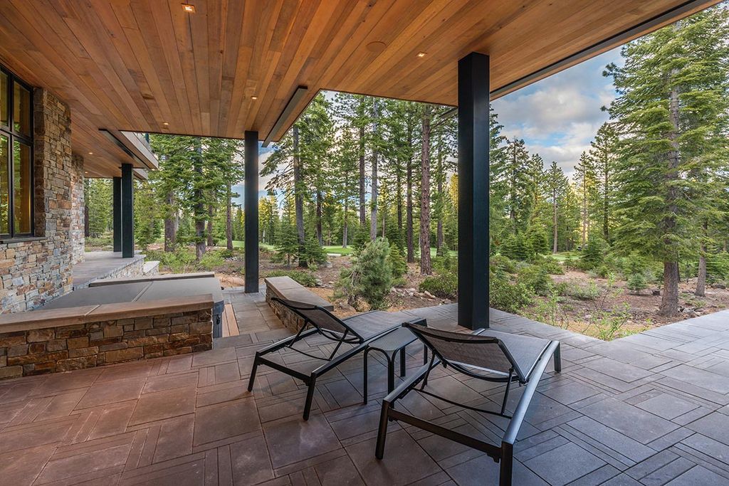 Martis Camp Home Lot 53 in Truckee, California was designed by Dennis Zirbel Architects in mountain contemporary style; this house offers impressive mountain views and expansive indoors and outdoors entertaining.