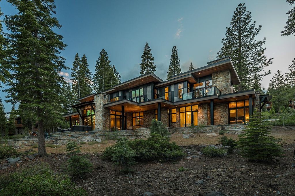 Martis Camp Home Lot 53 in Truckee, California was designed by Dennis Zirbel Architects in mountain contemporary style; this house offers impressive mountain views and expansive indoors and outdoors entertaining.