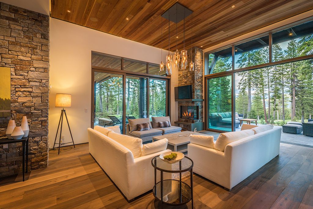 Martis Camp Home Lot 53 in Truckee, California was designed by Dennis Zirbel Architects in mountain contemporary style; this house offers impressive mountain views and expansive indoors and outdoors entertaining.