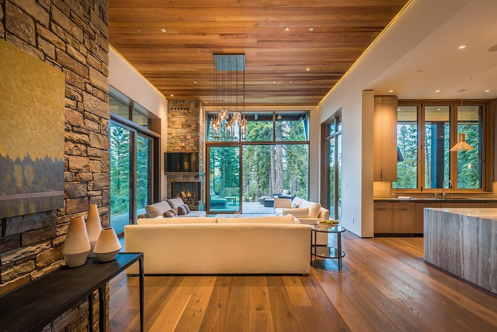 Martis Camp Home Lot 53 in Truckee, California was designed by Dennis Zirbel Architects in mountain contemporary style; this house offers impressive mountain views and expansive indoors and outdoors entertaining.