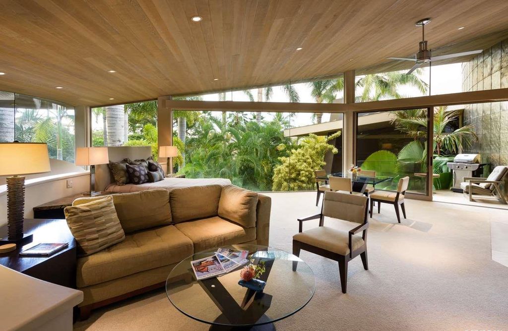 Makena Contemporary House in Kihei, Hawii perfectly situated on an intimate cove was designed by Guy Dreier Designs in tropical Modern style; this house is a livable work of art with its soaring ceilings, dramatic finishes, and innovative floor plan. 