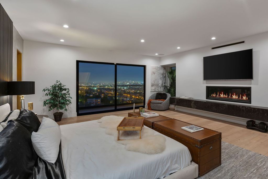 The Hollywood Hills Home is the pinnacle of luxury living showcasing unmatched explosive jetliner views now available for sale. This home located at 8428 Carlton Way, Los Angeles, California; offering 4 bedrooms and 6 bathrooms with over 5,300 square feet of living spaces.